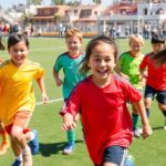 Youth soccer players playing on a sunny field in San Diego.