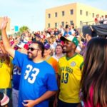 Fans cheering at a San Diego sports event.