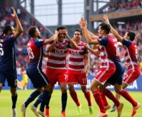 USMNT players celebrating a goal in January camp.