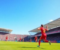 Soccer players in action on a vibrant field.