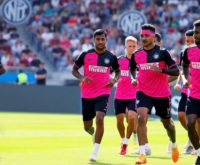 Inter Miami players training in pink and black kits.