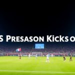 Soccer players in action on a brightly lit field.