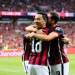 Miguel Almirón celebrating with teammates at Atlanta United.